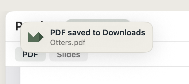 The 'PDF saved to Downloads' toast at the top of the window with the filename Otters.pdf.